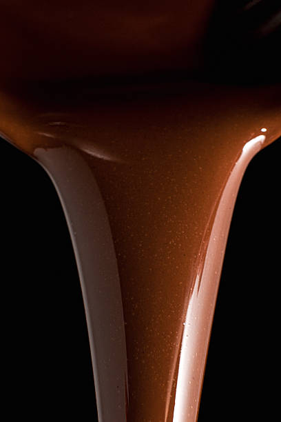 istock Pouring melted milk chocolate from saucepan 2218518110