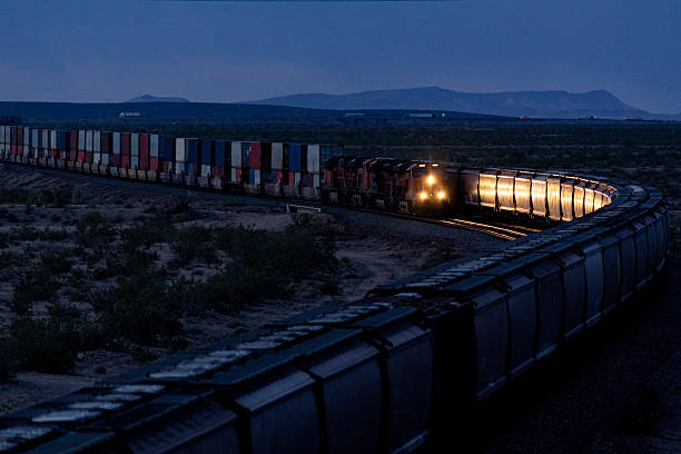 istock End of day run as two trains pass at dusk 2218518249