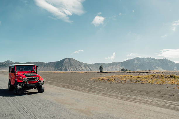 Tourists using Off-Road 4x4 Car in Mount Bromo, Bromo Tengger Semeru National Park, East Java, Indonesia.