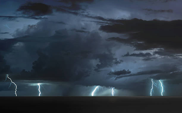 istock lightning bolts over the sea 2218520417