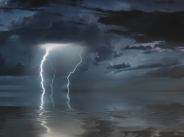 istock lightning bolts reflection over the sea 2218522204