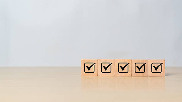 istock Checklist, Corporate regulatory and compliance, approve, Quality control management, ISO certification, service quality warranty concept. Check mark icon on wooden cube blocks with copy space 2218522632