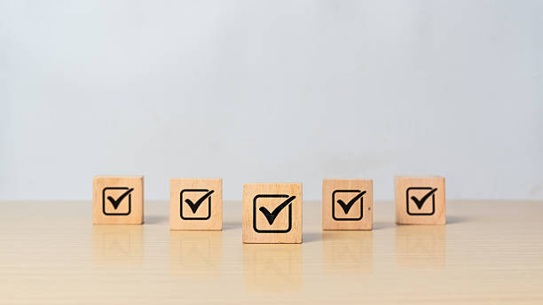 istock ISO certification and quality warranty concept. Wooden blocks with check mark icon symbolizing regulatory approval and compliance 2218522633