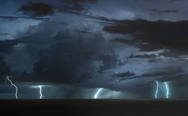 istock lightning bolts over the sea 2218523210