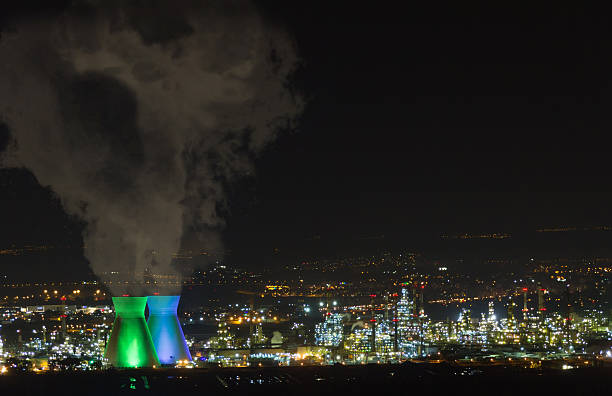Industrial Refineries at night, with smoke HDR