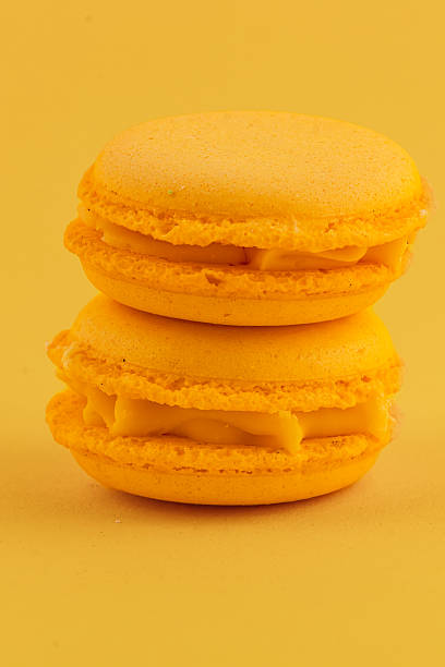 istock Delicious yellow macarons stacked on a bright background 2218528915