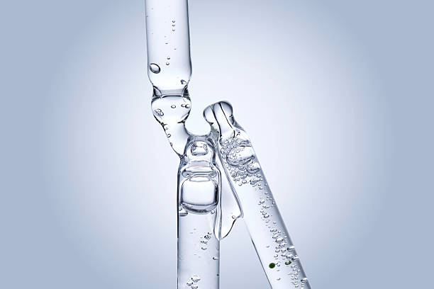 istock Three different face serum pipettes on a neutral background. 2218528924