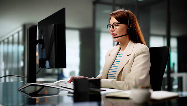 istock Friendly Sales Support Specialist Wearing Headset 2218529117