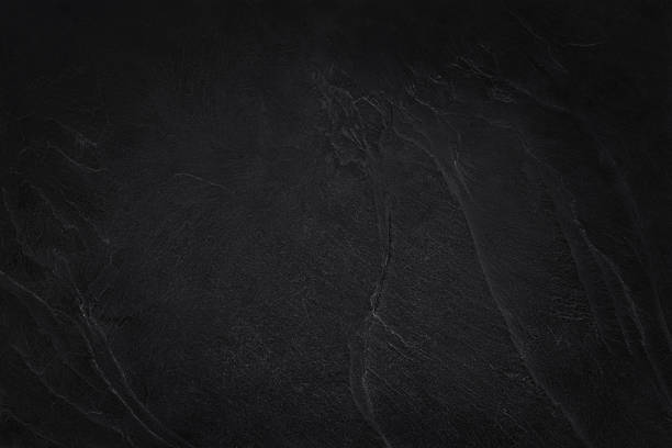 istock Dark grey black slate texture in natural pattern with high resolution for background and design art work. Black stone wall. 2218529581