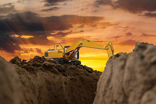 istock Excavator   are digging canalize  in the construction site . 2218532610