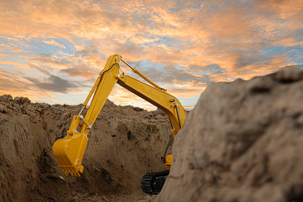 istock Selective focus ,Excavator with Bucket  are digging canalize the soil. 2218532651