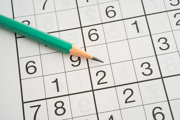 istock Sudoku puzzle game playing to challenge brain. 2218534358