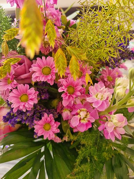 Summer bouquet. Beautiful pink dahlias, lisianthus and zinnias arrangement. Birthday or wedding bouquet made of summer flowers close up.