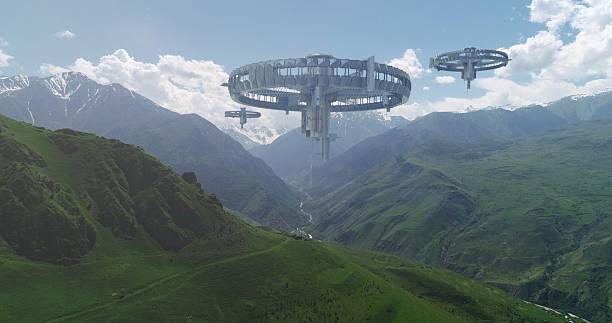 This photo shows an alien spacecraft hovering over a snow-covered mountain pass under a clear sky.