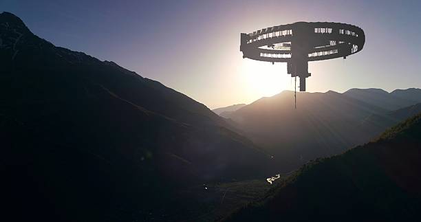 istock This photo shows a mysterious alien craft silhouetted by sunset over dark mountain ridges. 2218536433