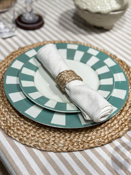 istock Image of formal dining table setup, dinner plates, crockery, cutlery, tablecloth, napkins, placemats arranged in stylish table setting 2218536458