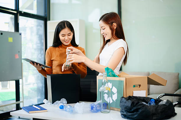 istock Eco friendly teamwork with this office recycling scene. Perfect for showcasing sustainability, collaboration, and environmental 2218538217