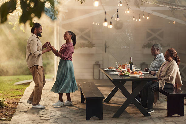 istock Happy black couples having fun on a party in the backyard. 2218539132