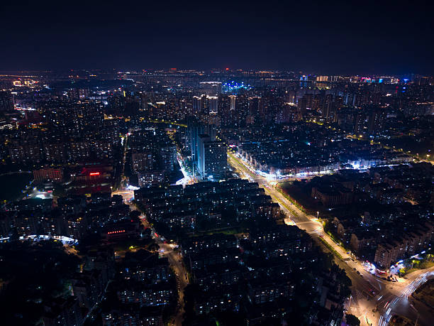 istock Nighttime Cityscape with Illuminated Buildings and Reflective Water 2218540122