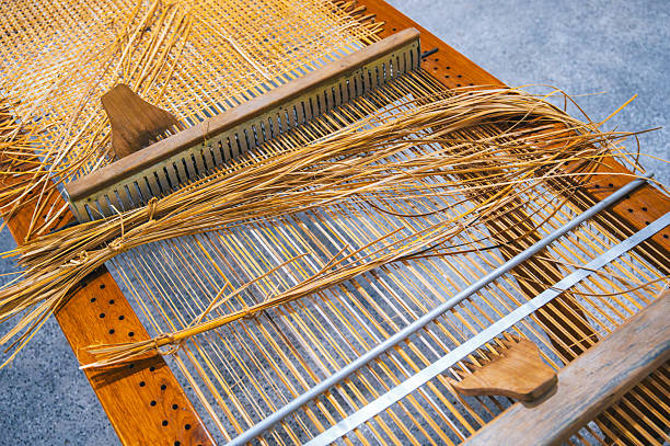 istock weaving and making a handmade rug. close-up of a loom. 2218540627
