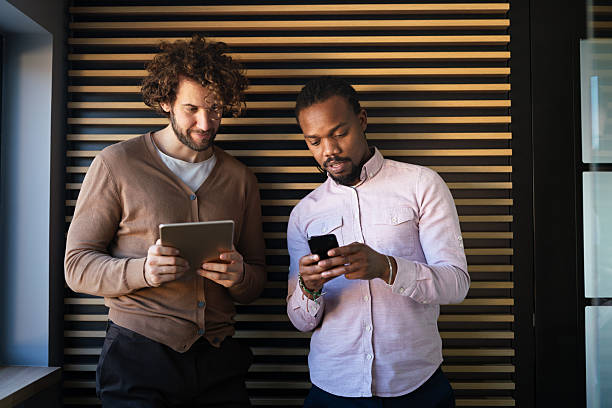 istock Group of young multi-ethnic startup business team collaborating on project in modern office 2218544205