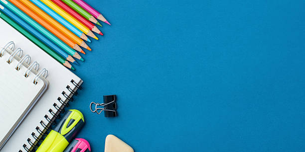 istock Bright school supplies on a blue background 2218544630