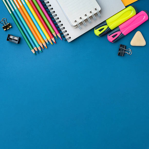 istock Bright school supplies on a blue background 2218544634