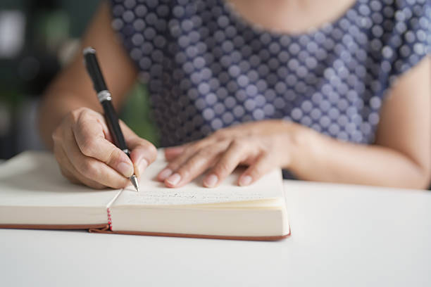 istock Senior Asian woman Work from home making list or writing diary. 2218545597