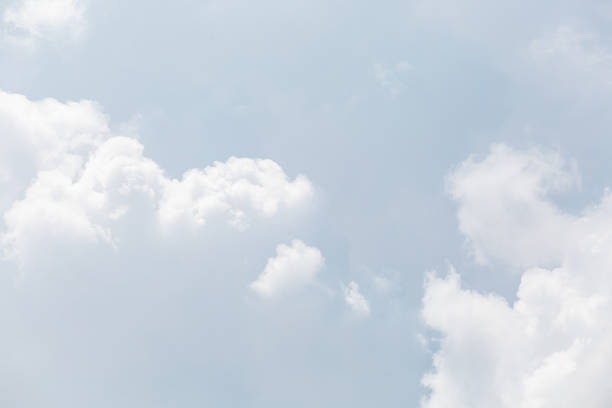 istock Soft White Clouds Against a Bright Blue Sky on a Sunny Day 2218547175