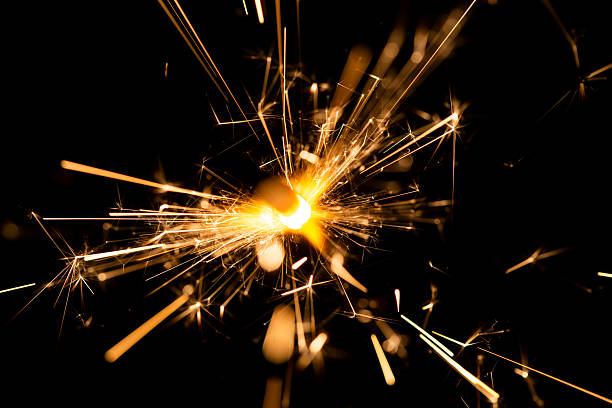 istock Bright Sparkling Firework Explosion with Glowing Light and Radiant Spark Trails 2218547397