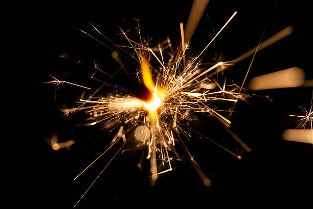 istock Bright Sparkler Bursting With Light Against Dark Background During Celebration Event 2218547399