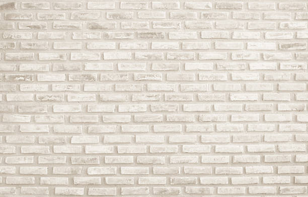 istock Detail of modern cream brick wall background photo. Brown light brick wall texture background for stone tile block painted in yellow light color wallpaper modern interior and exterior backdrop design. 2218549708