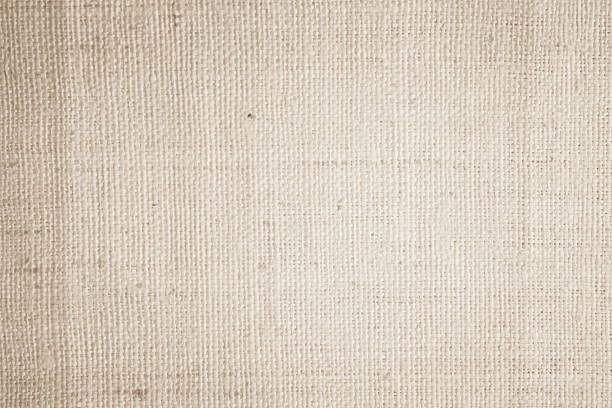istock Brown sackcloth woven texture background in natural pattern. Jute hessian burlap, linen background in light beige cream color blank. Weaving canvas fiber line cotton cloth textured as organic. 2218550651
