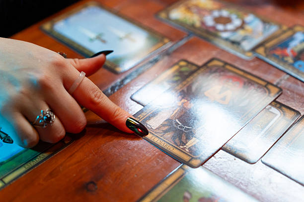 istock Fortune teller reading tarot cards on wooden table 2218550847