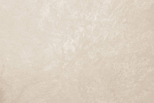 Colour old concrete wall texture background. Close up retro plain cream color cement wall background texture. Design paper vintage parchment element.