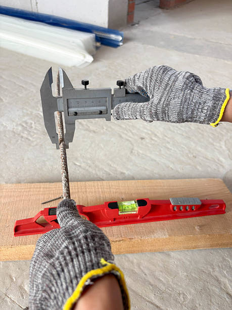 istock Metal caliper, construction and working measuring tool in the process of measuring the diameter of reinforcement. 2218557533