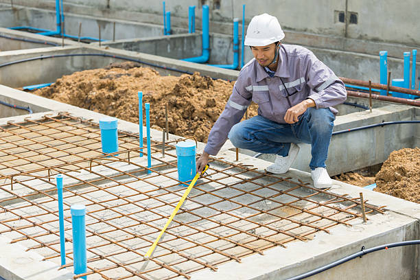 istock Asian construction engineer, Japanese builder worker male working inspecting footing house building. 2218565786