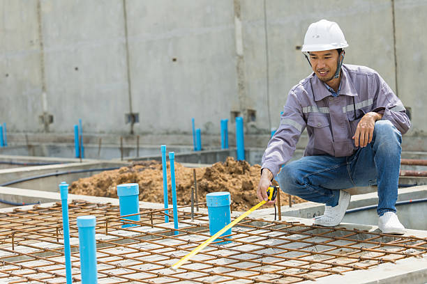istock Asian construction engineer, Japanese builder worker male working inspecting footing house building. 2218565789