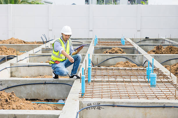 istock Asian construction engineer, Japanese builder worker male working inspecting footing house building. 2218565856
