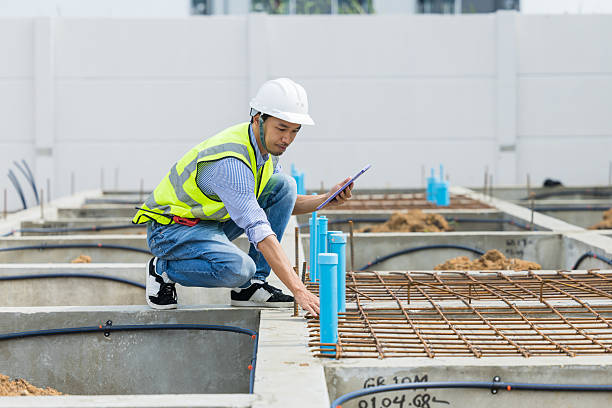 istock Asian construction engineer, Japanese builder worker male working inspecting footing house building. 2218565901