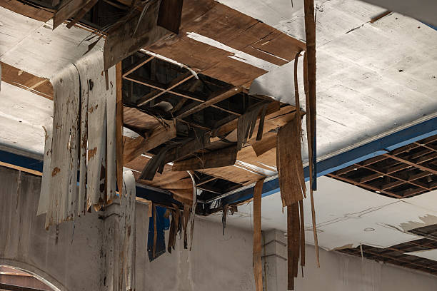 istock Ruin decay weathered old plywood ceiling collapse pull down, bad poor wood building roof structure 2218566166