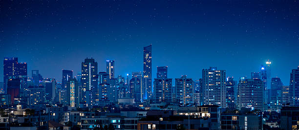 istock night city skyline in blue color panoramic for modern metro background 2218566167