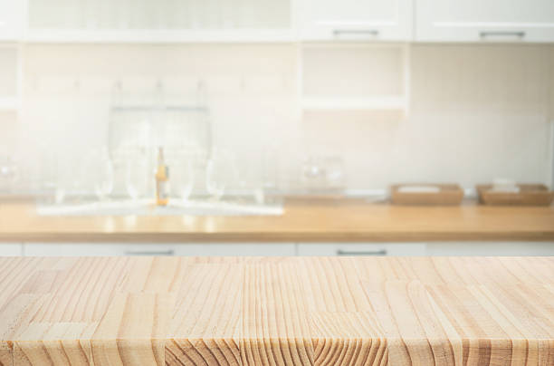 istock Selective focus.Blank wood counter,table top on blur white kitchen wall background. 2218567571