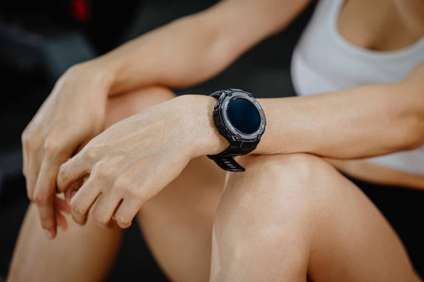 istock sport people wearing wrist smart watch health data tracker or exercise HR measure device 2218568340