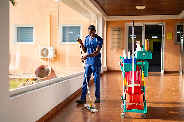 istock Male Janitor Cleaning Floor 2218573211