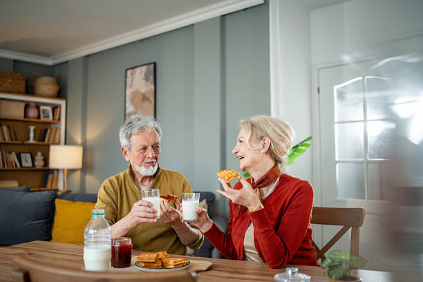 istock Happy senior couple enjoying breakfast at home 2218578596