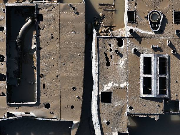 istock Aerial view of a rusty shipwreck in muddy water. 2218580546