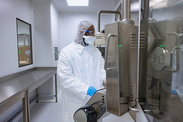 istock Close up portrait of engineer wearing protective workwear touching a screen in a lab 2218581335