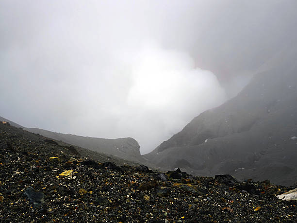 The crater of Mt. Naka, which contains an active volcano that continuously emits smoke and has occasional eruptions. It's located in Aso Kujū National Park in Kumamoto Prefecture, on the island of Kyushu. Mount Aso is one of the largest caldera volcanos in the world.