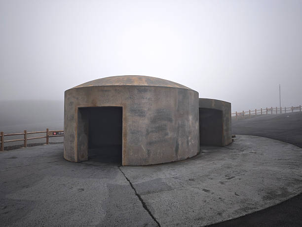 Evacuation shelters on the crater of Mt. Naka, which contains an active volcano that continuously emits smoke and has occasional eruptions. It's located in Aso Kujū National Park in Kumamoto Prefecture, on the island of Kyushu. Mount Aso is one of the largest caldera volcanos in the world.